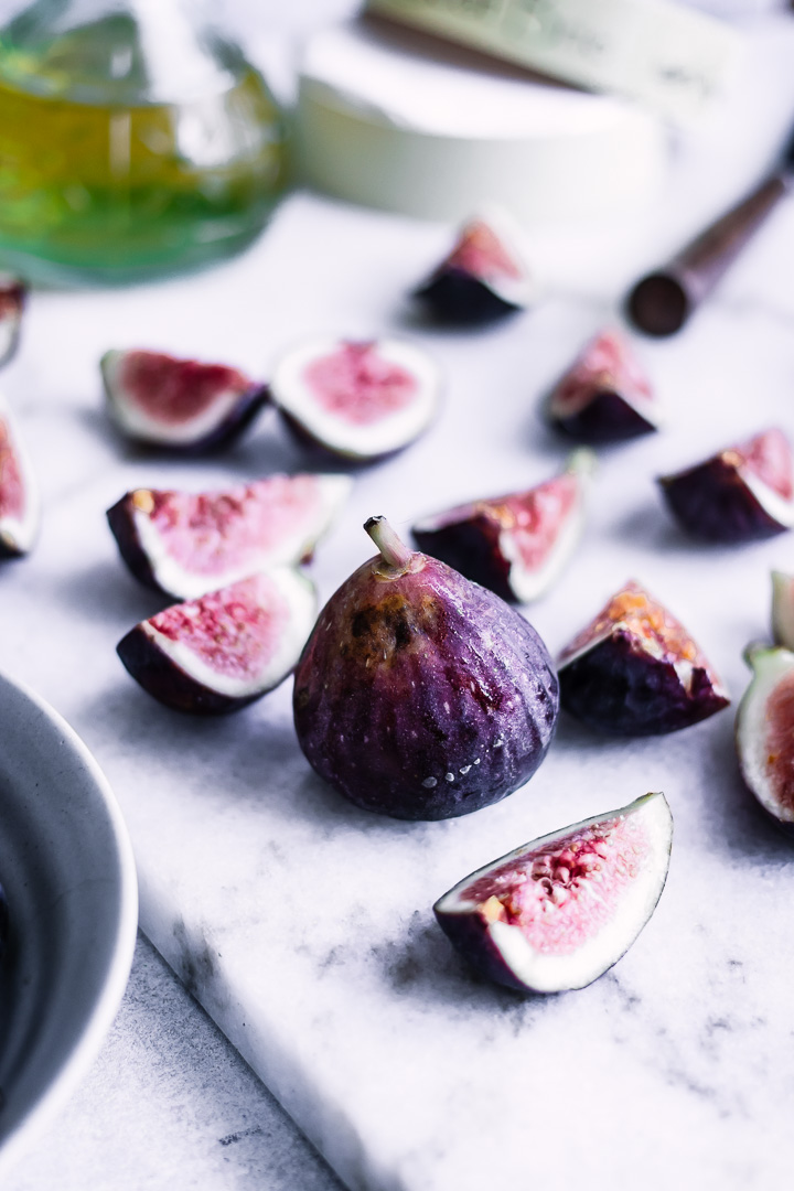 Sliced figs on a cutting board.