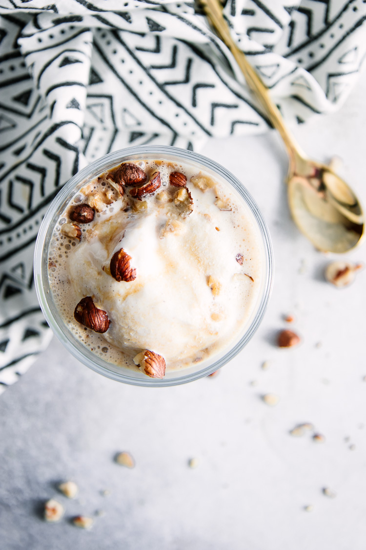 A top-down photos of a vanilla gelato with hazelnut liqueur and an espresso drizzle.