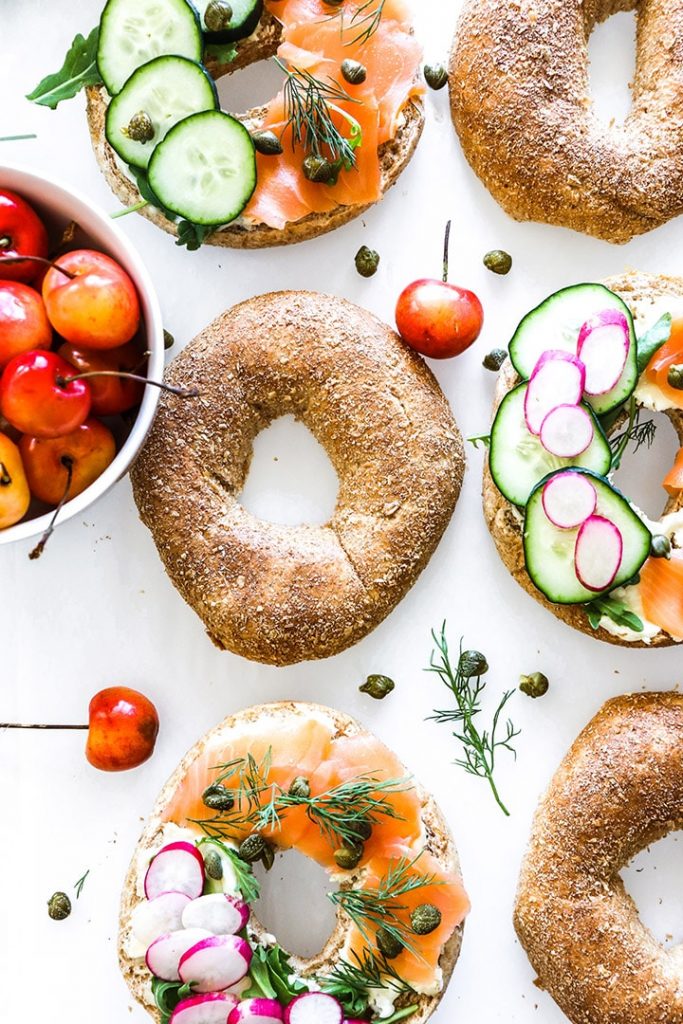 Smoked salmon bagels with cream cheese, dill, capers and all the veggies! Easy recipe for brunch or a weeknight no-cook dinner.