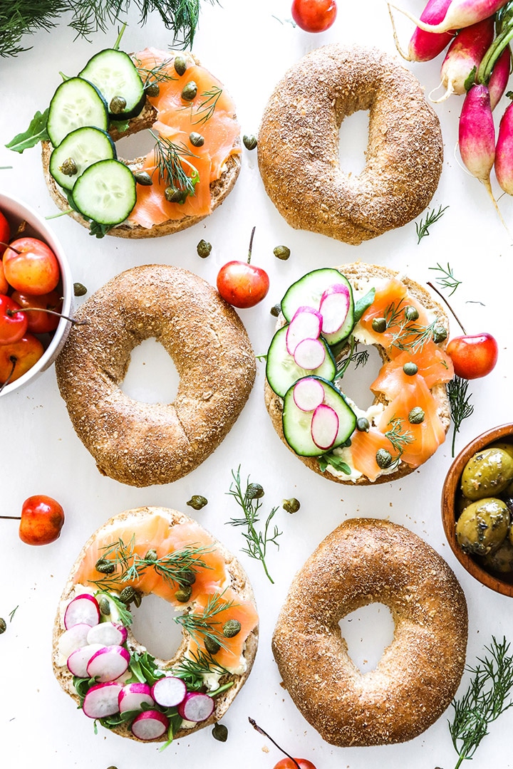 Smoked salmon bagels with cream cheese, dill, capers and all the veggies! Easy recipe for brunch or a weeknight no-cook dinner.