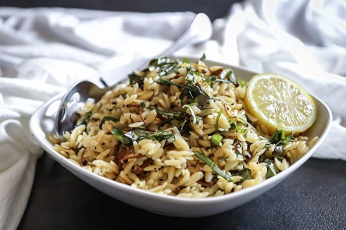 Vegan Mushroom Orzo Salad with enoki, fresh basil and drizzled in black truffle oil. Served warm or cold this vegan pasta salad is comfort food at its best!