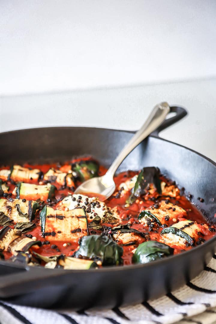 Grilled Zucchini Goat Cheese Bake - zucchini stuffed with herbed goat cheese and baked with marinara sauce. Serve with fresh bread for an easy dinner!