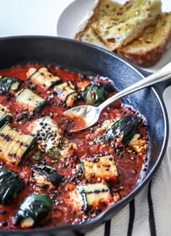 Grilled Zucchini Goat Cheese Bake - zucchini stuffed with herbed goat cheese and baked with marinara sauce. Serve with fresh bread for an easy dinner!