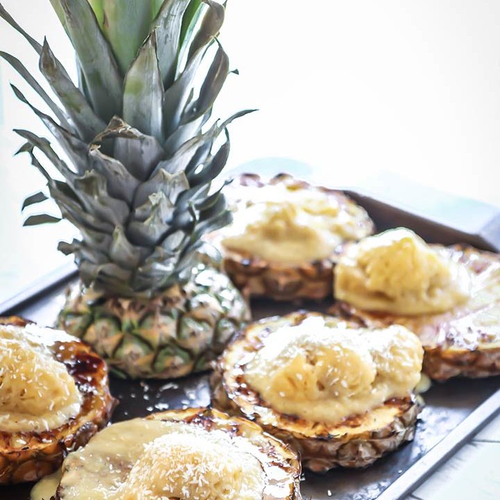 Grilled Pineapple with Mango Banana Nice Cream topped with fresh coconut and a bourbon sauce drizzle, a fresh and tasty tropical summer treat!
