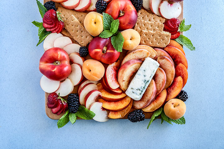 Summer Stone Fruit Cheese Platter, a summer fruit spread of peaches, nectarines and apricots with strong blue cheese and wildflower honey.