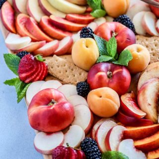 Summer Stone Fruit Cheese Platter, a summer fruit spread of peaches, nectarines and apricots with strong blue cheese and wildflower honey.