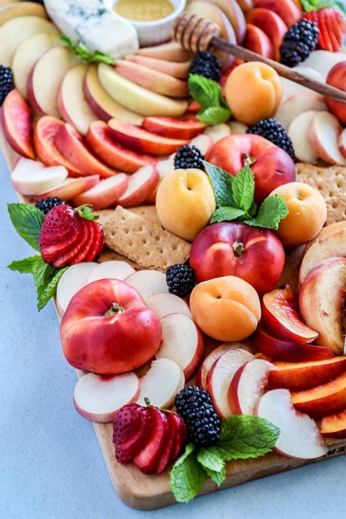 Summer Stone Fruit Cheese Platter, a summer fruit spread of peaches, nectarines and apricots with strong blue cheese and wildflower honey.