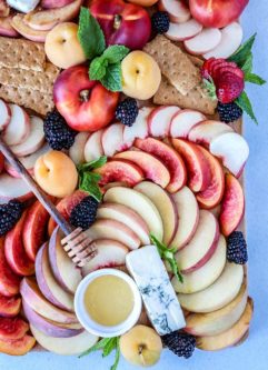 Summer Stone Fruit Cheese Platter, a summer fruit spread of peaches, nectarines and apricots with strong blue cheese and wildflower honey.