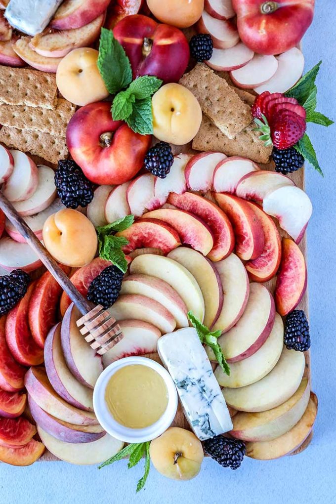 Summer Stone Fruit Cheese Platter, a summer fruit spread of peaches, nectarines and apricots with strong blue cheese and wildflower honey.