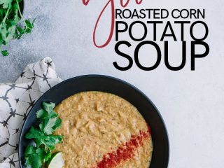 Vegan corn and potato soup in a black bowl with red paprika, green cilantro and limes, and a white and black patterned napkin with the words "vegan roasted corn potato soup" in black and red writing.