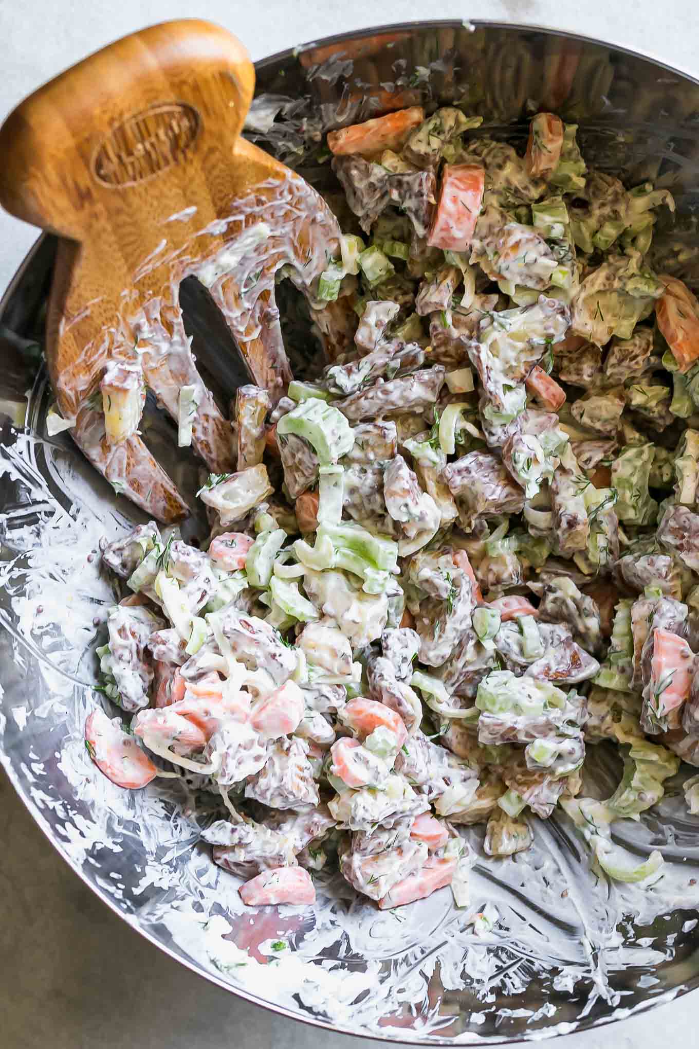 roasted potato salad in a bowl after mixing