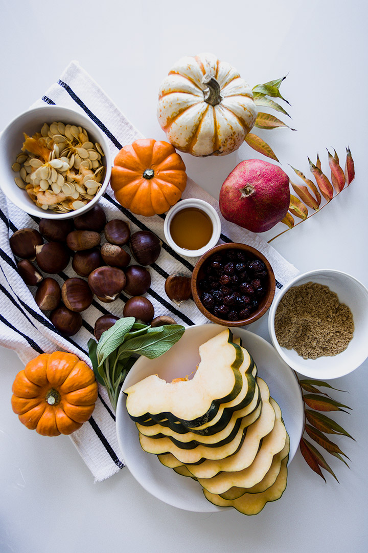 Fall Harvest Snack Board, a pickable platter of roasted pumpkin, acorn squash and autumn chestnuts with dried apple chips, pomegranate and cranberries.