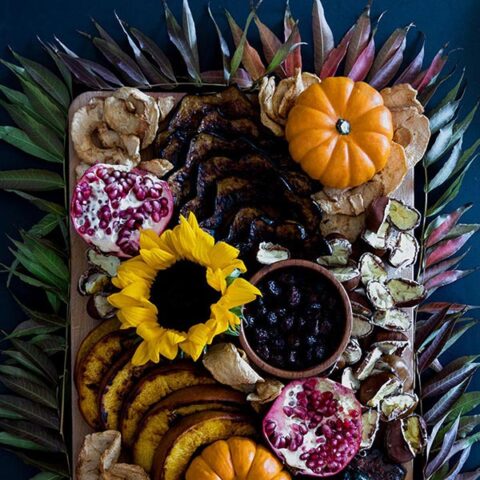 Fall Harvest Snack Board, a pickable platter of roasted pumpkin, acorn squash and autumn chestnuts with dried apple chips, pomegranate and cranberries.