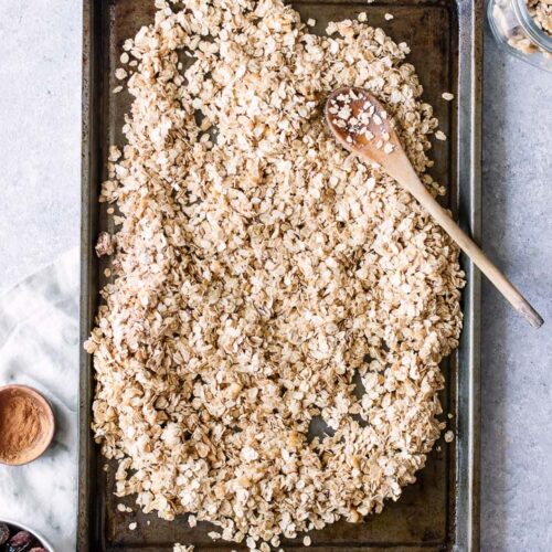 Raw oat and walnut granola on a sheetpan.