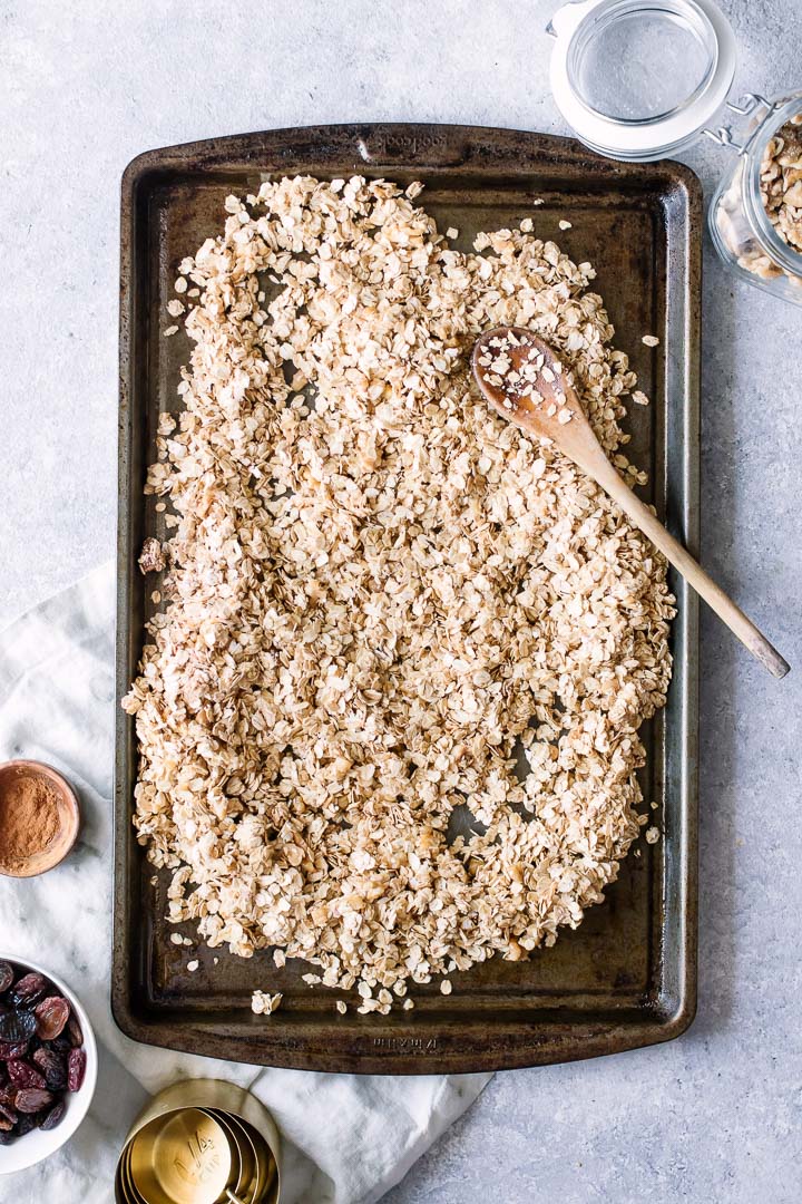 Raw oat and walnut granola on a sheetpan.