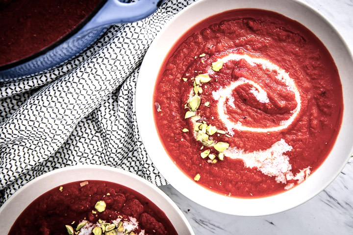 Red Beet Apple Soup, a delicious soup of red beets, fresh fall apples, celery, and herbs that will keep you warm and cozy on cold weather nights.
