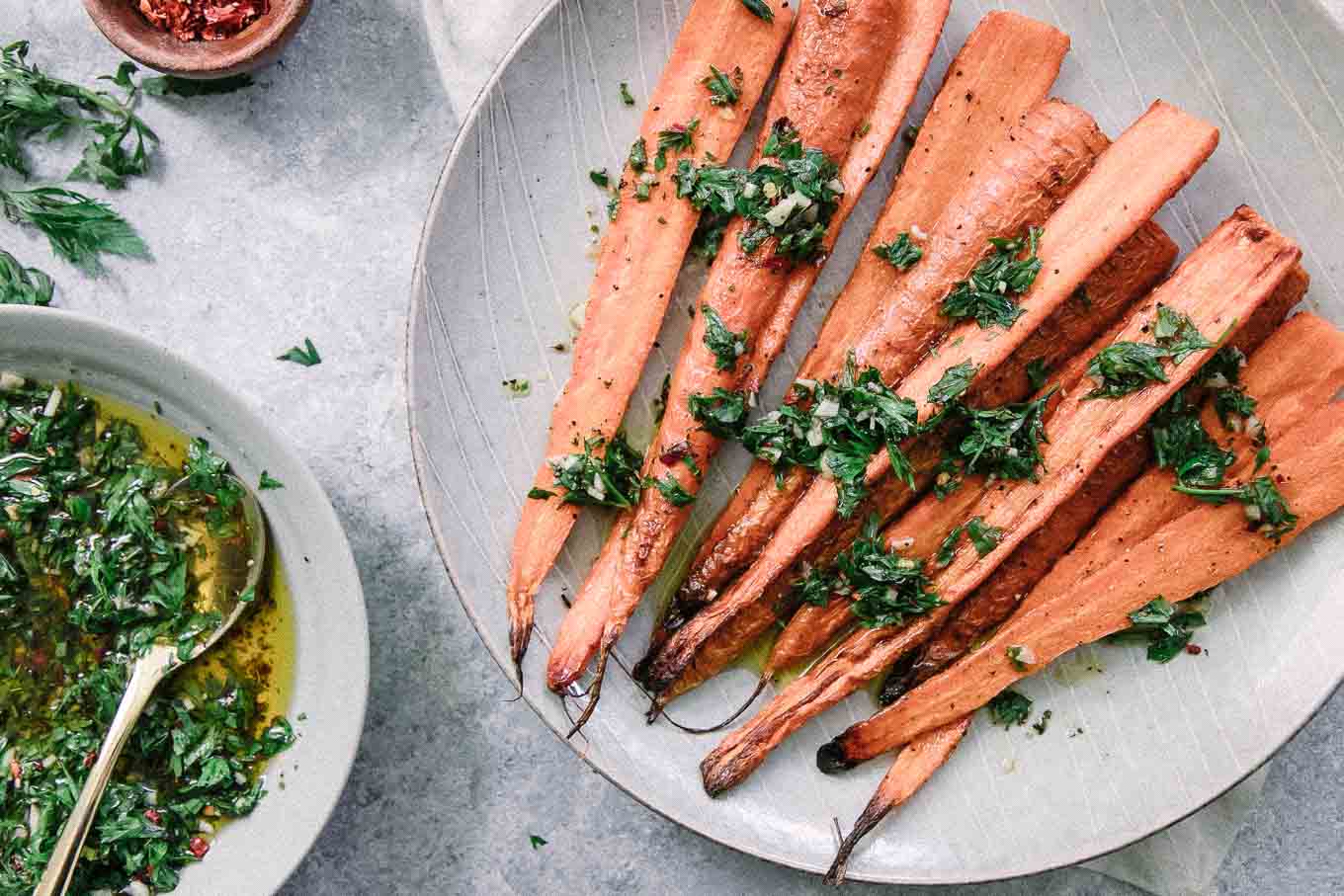 chimichurri drizzled over roasted carrots