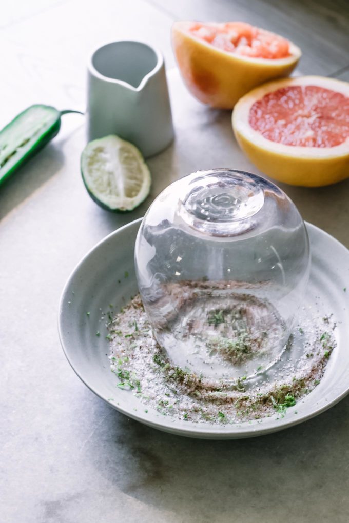 a cocktail glass upside down on a plate of salt