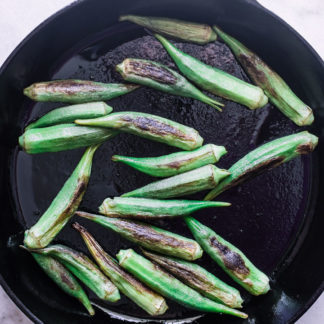 A cast iron skillet with okra.