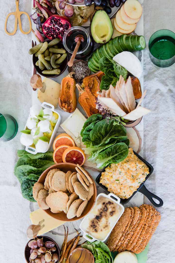 A platter of brunch food on a while table.