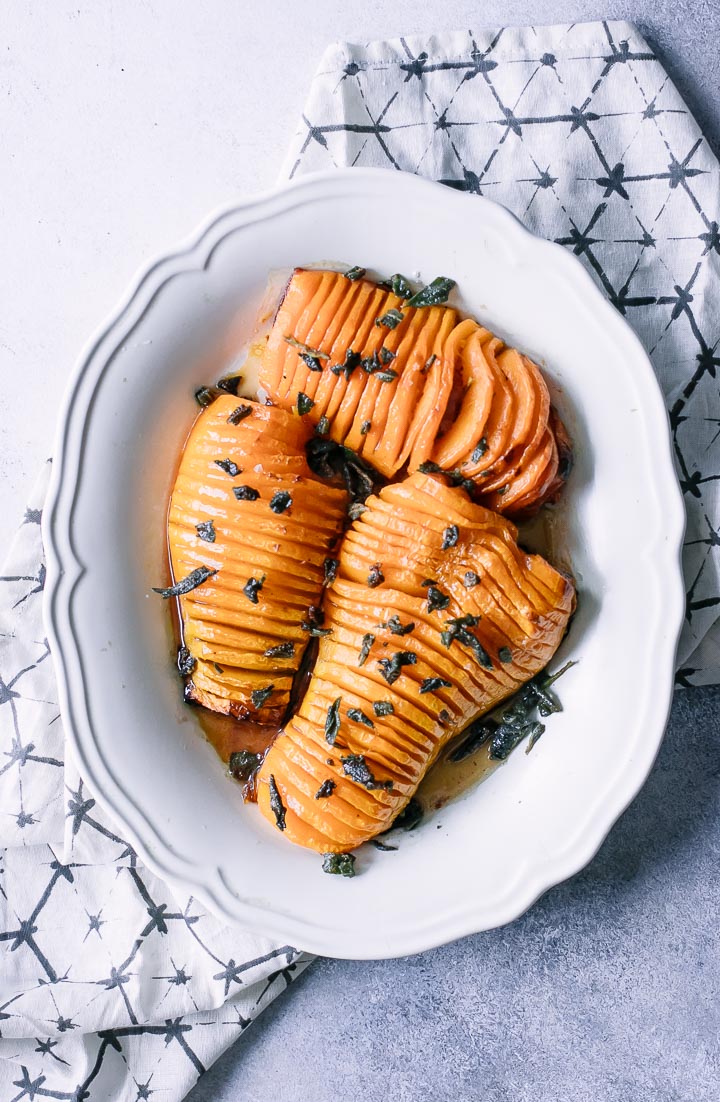 thinly sliced butternut squash on a white plate
