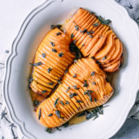 thinly cut roasted butternut squash with fried sage on top