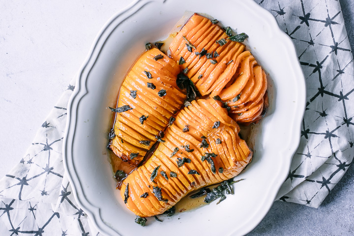 thinly cut roasted butternut squash with fried sage on top