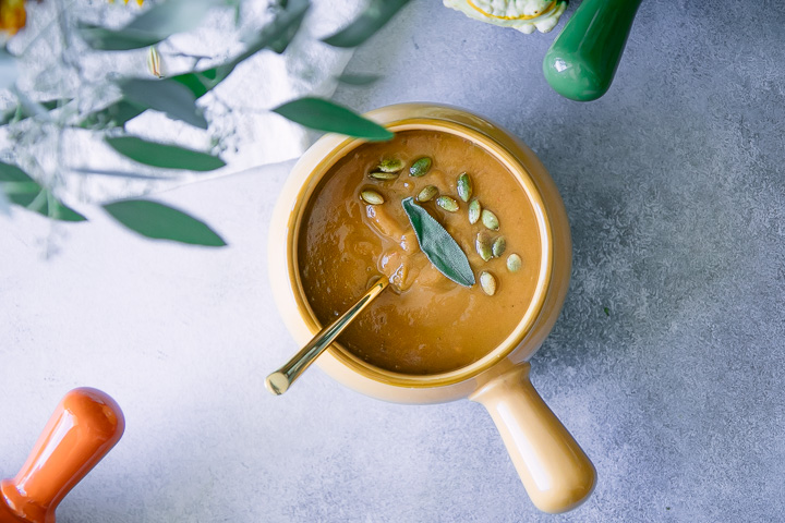 instant pot pumpkin sage soup on a blue and white table