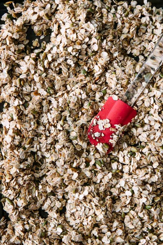 A mixture of granola on a baking sheet