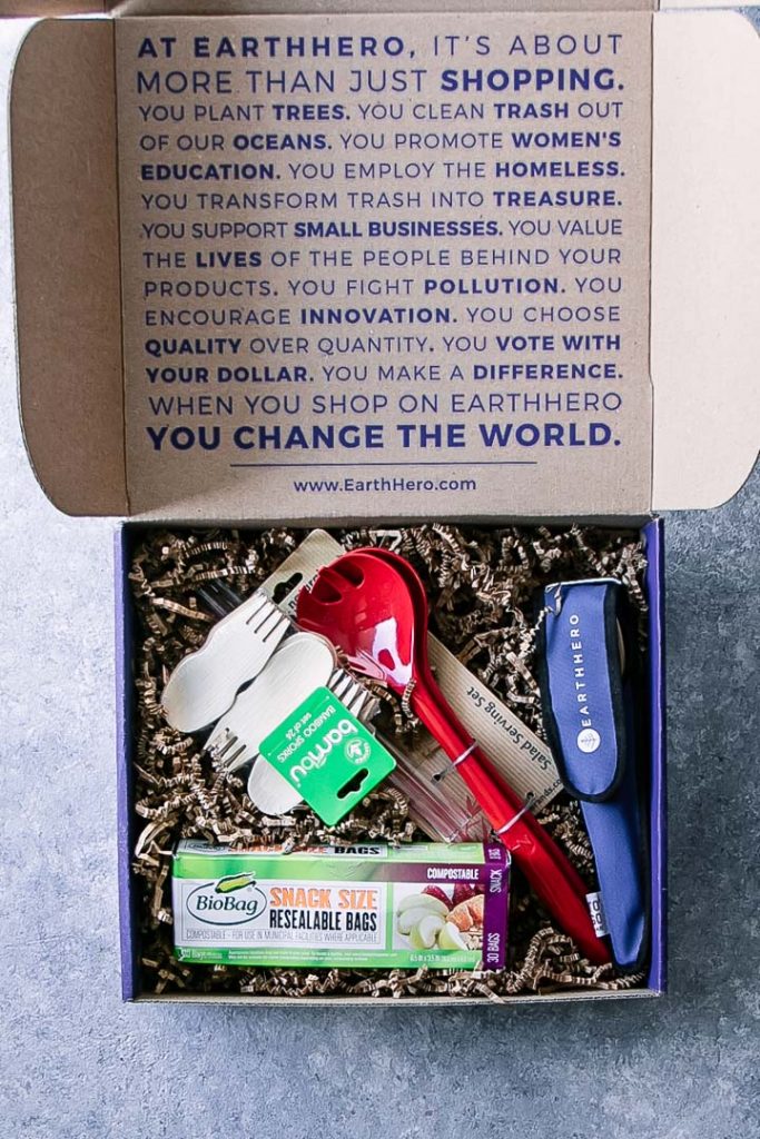 An Earth Hero box with eco-friendly kitchen tools on a blue table