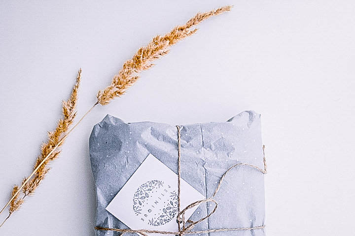 environmentally-friendly gift wrapped blue present