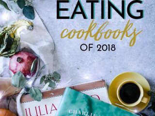 seasonal cookbooks on a table with pomegranates, leaves, and pumpkins