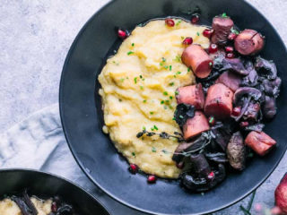 roasted mushrooms and carrots in wine sauce with cheesy polenta