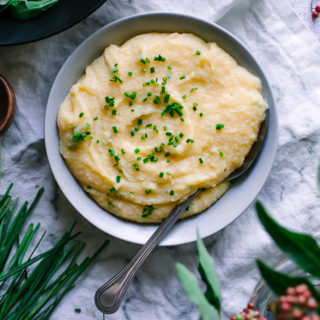 polenta with cheddar and chives on a white napkin