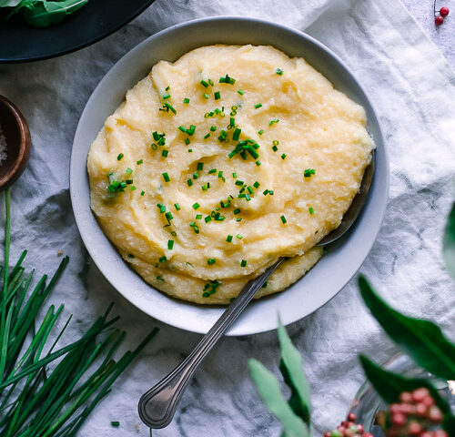 polenta with cheddar and chives on a white napkin
