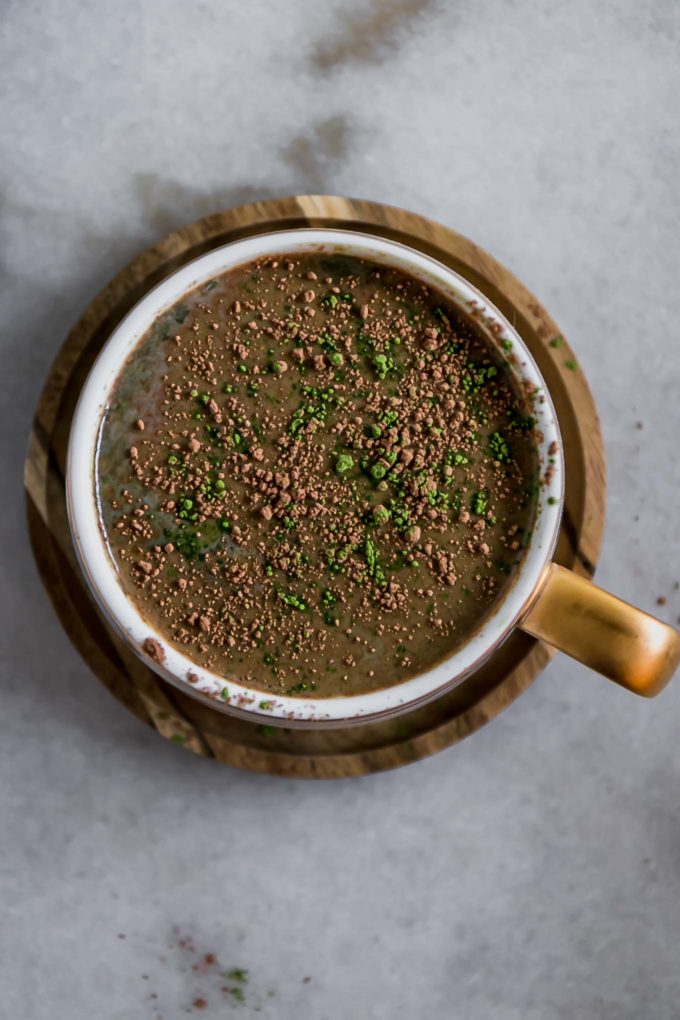 the top of a matcha latte with sprinkled cocoa powder and matcha green tea powder