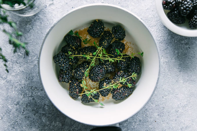 blackberries and thyme in a saucepan