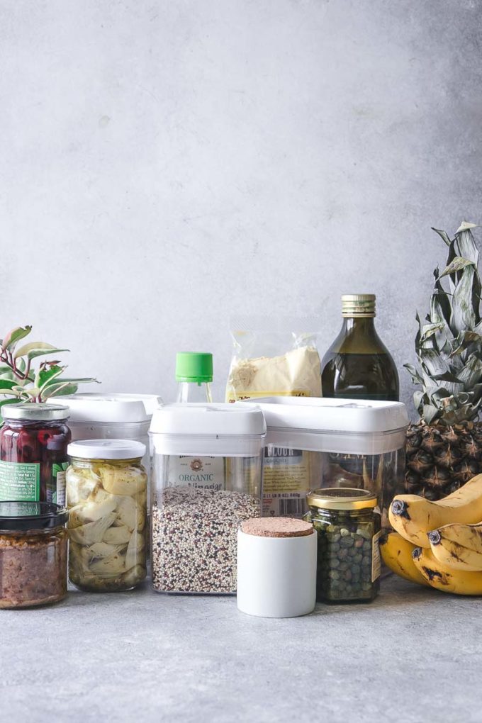 jars and boxes of food and fruit on a kitchen counter