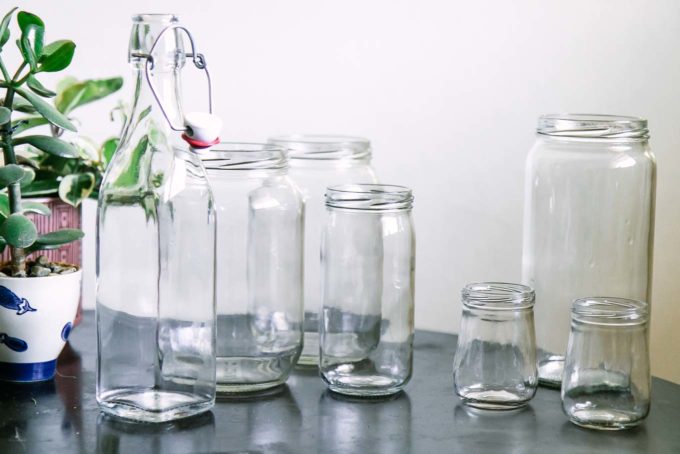 empty glass food jars on a wooden table