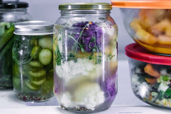 a jar of quick pickled cauliflower in the refrigerator