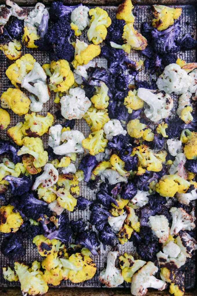 roasted rainbow cauliflower on a baking sheet