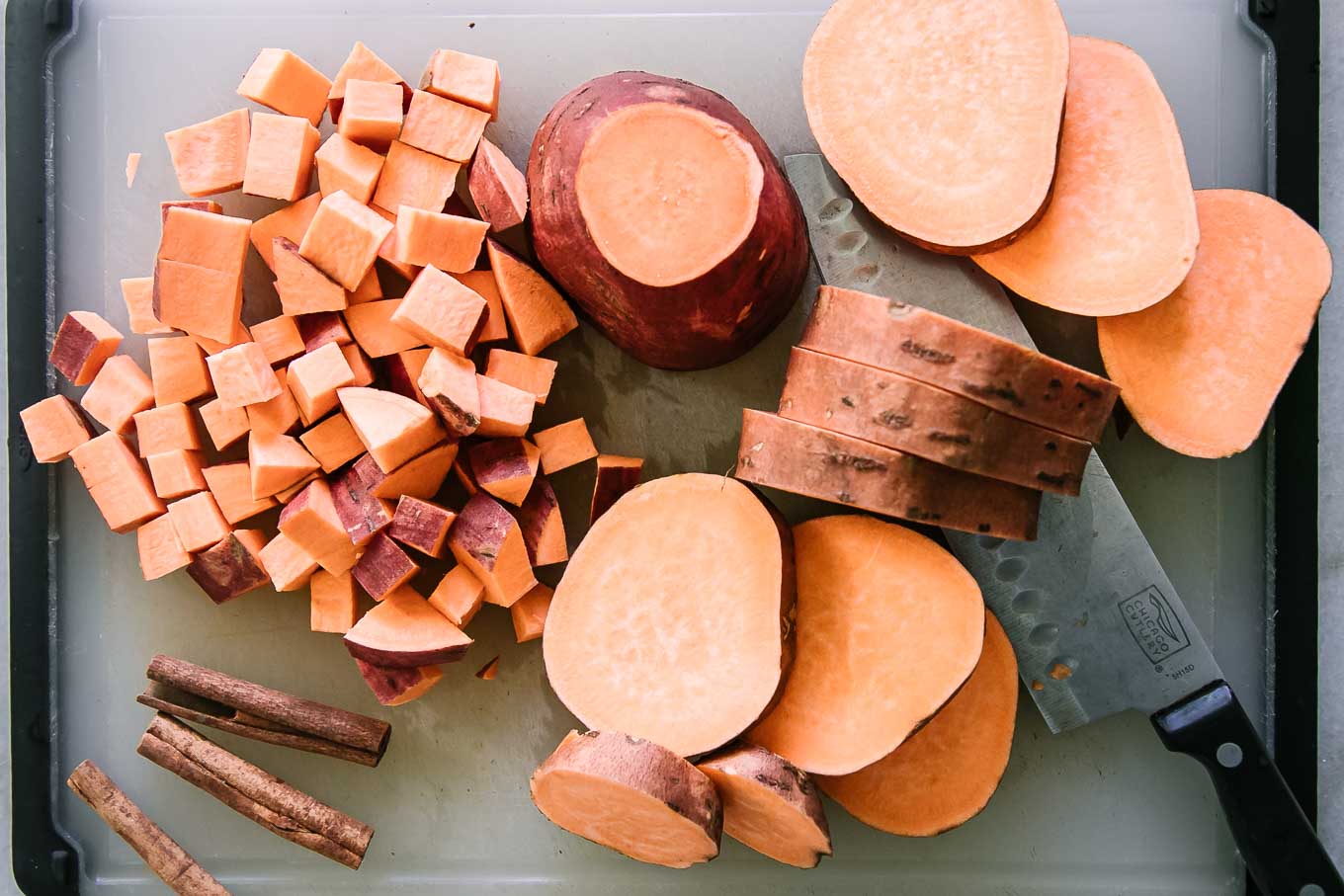sliced and cubed sweet potatoes on a cutting board