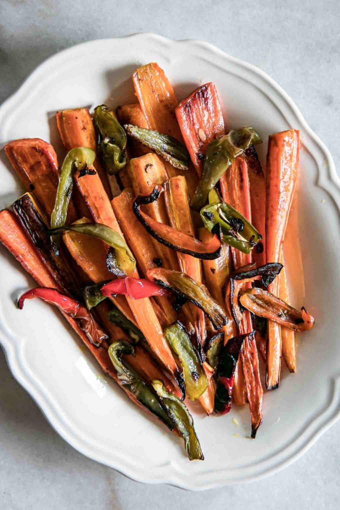 baked carrots and sweet peppers on a white plate