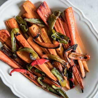 roasted carrots and bell peppers on a white plate