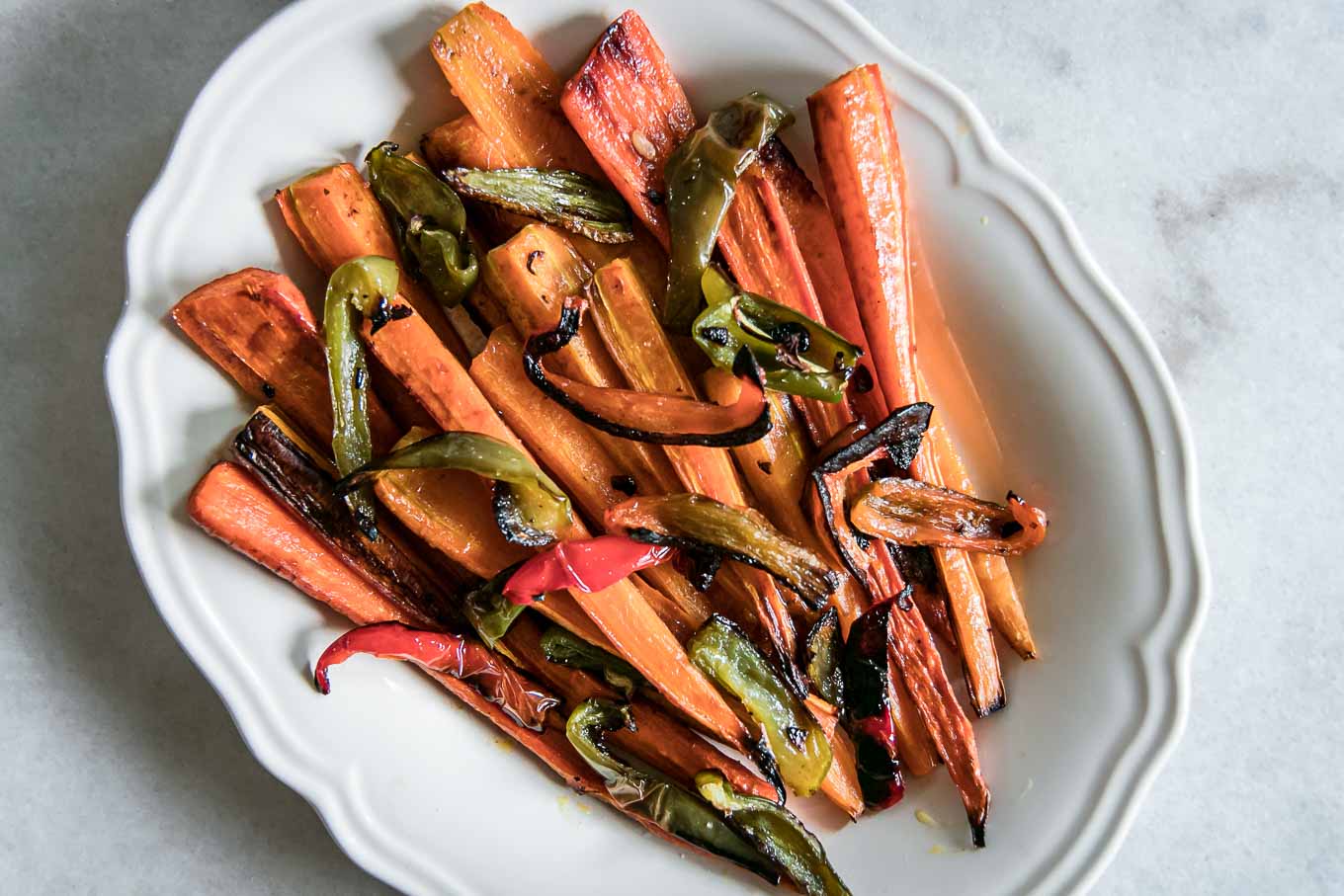 roasted carrots and bell peppers on a white plate