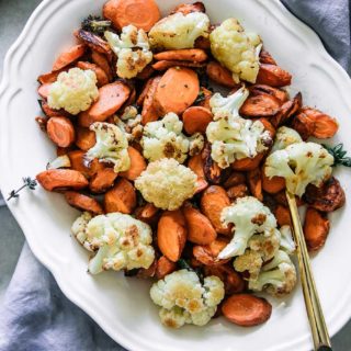 baked cauliflower and carrot side dish on a white table
