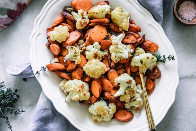 baked cauliflower and carrot side dish on a white table