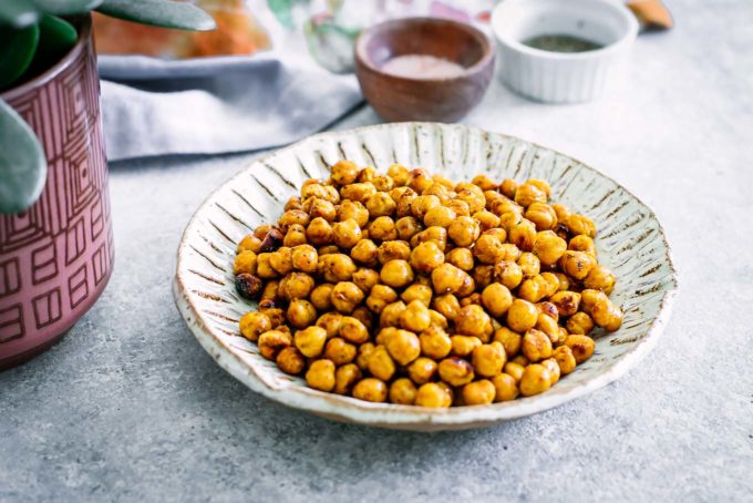 baked chickpeas in a bowl on a white table