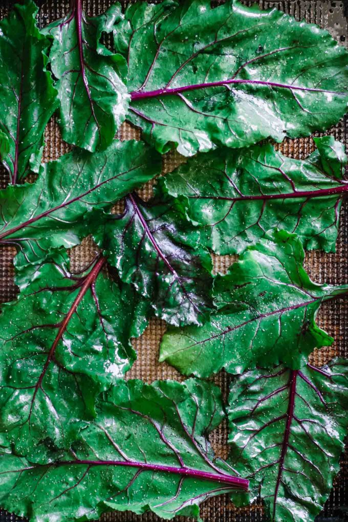 beet leaves on a sheet pan before baking