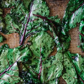 roasted beet leaves on a baking sheet